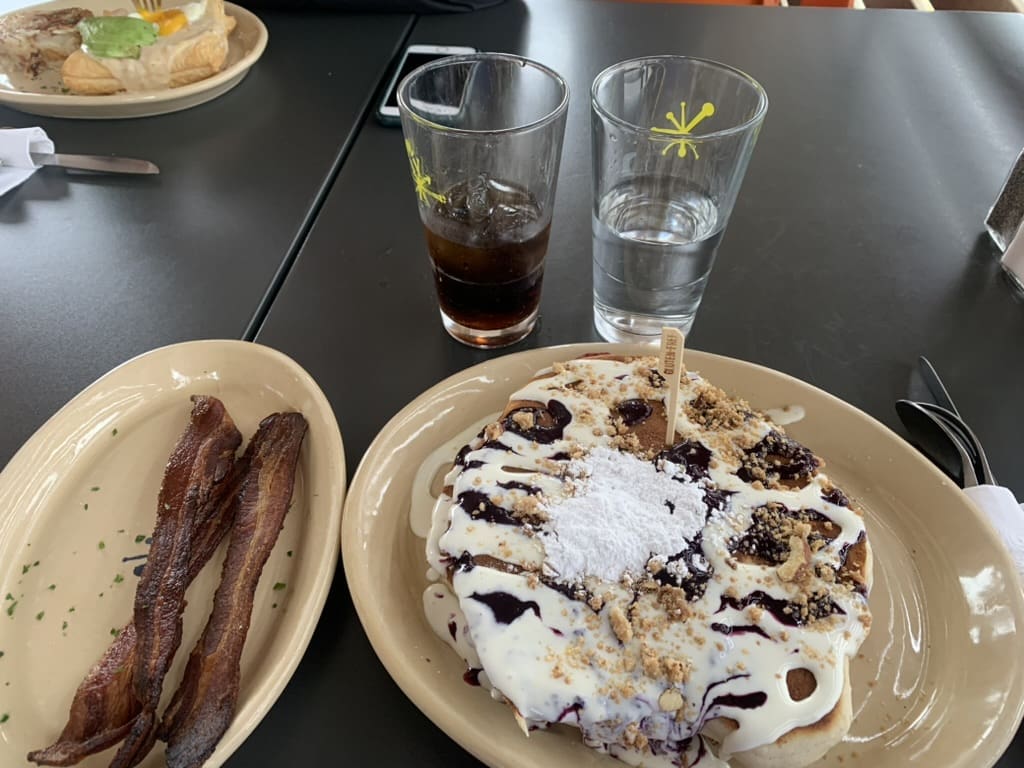 Gluten Free at Snooze. Gluten Free Blueberry Danish pancakes with crispy bacon and two beverages
